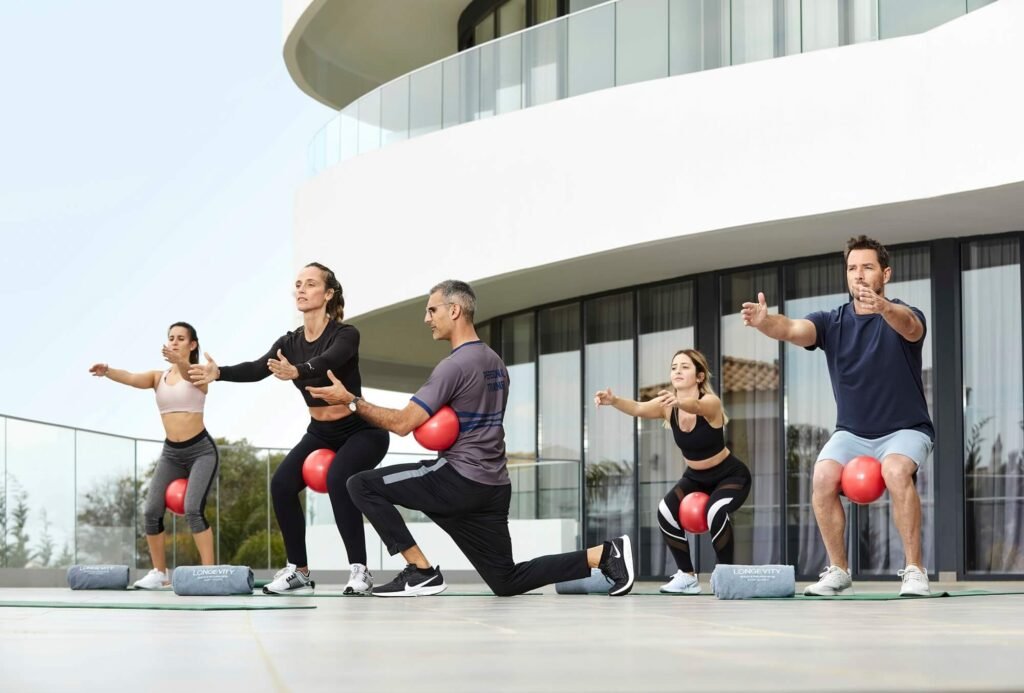 Group fitness training session at Portugal wellness retreat.