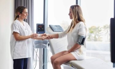 Doctor consulting female guest at Portugal medical spa.