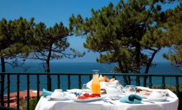 Healthy breakfast overlooking ocean at Portugal luxury retreat.