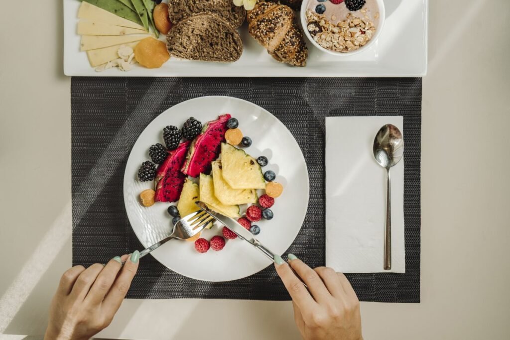 Healthy breakfast bowl with fruits, nuts, and yogurt.