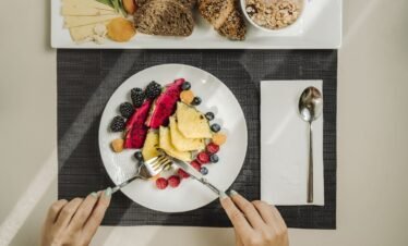 Healthy breakfast bowl with fruits, nuts, and yogurt.