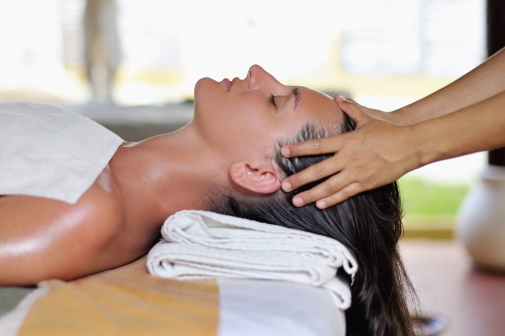Relaxing head massage therapy at luxury spa.