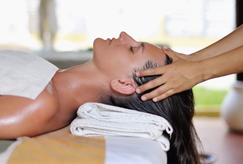 Relaxing head massage therapy at luxury spa.