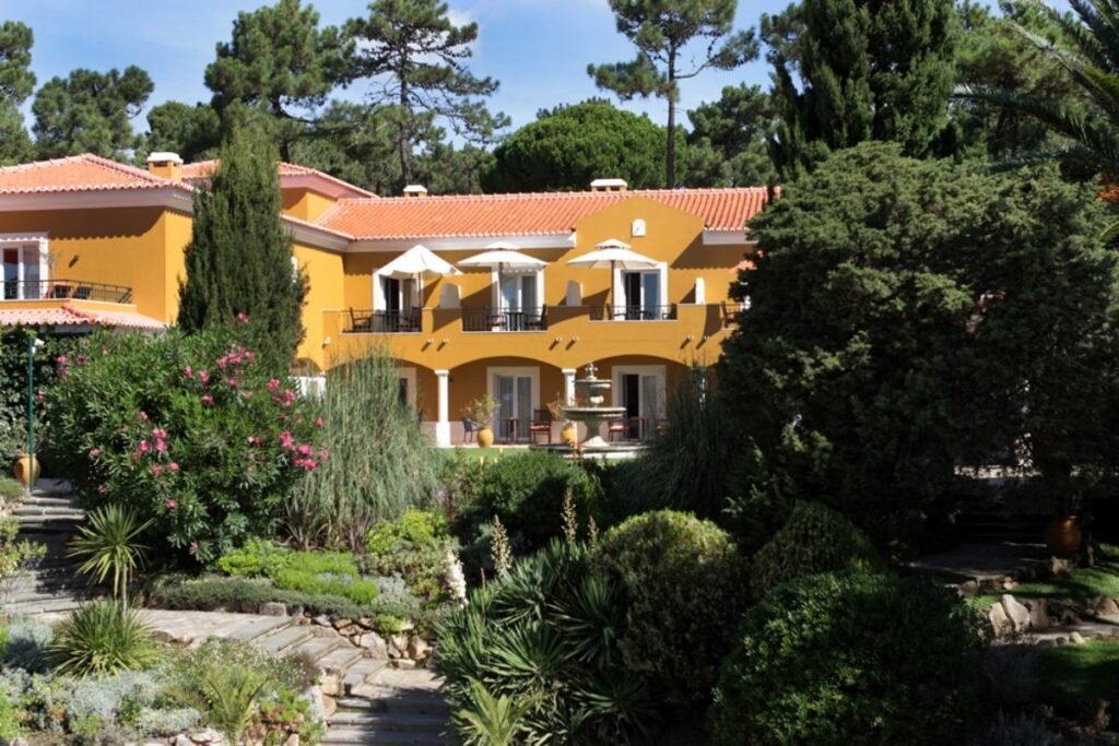 Luxury yellow villa in Cascais, Portugal wellness retreat.