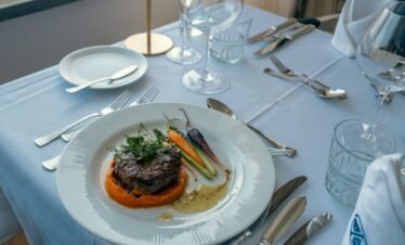 Gourmet fine dining plate served at Portugal wellness retreat.